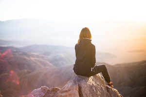 sitting on rock in canyon