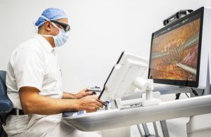 This is an image from Medtronic showing Dr. Jihad Kaouk, Cleveland Clinic's robotic surgery chair, using Hugo RAS.