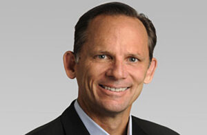 A headshot photo of Darrin Uecker.