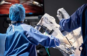 A photo of a surgeon using a surgical robot.