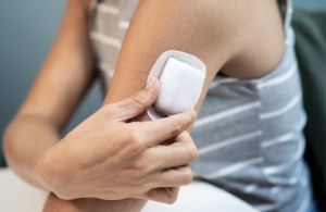 Insulet Omnipod 5 in focus on the arm