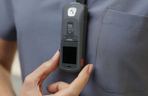 A mobile communications device with a panic button.