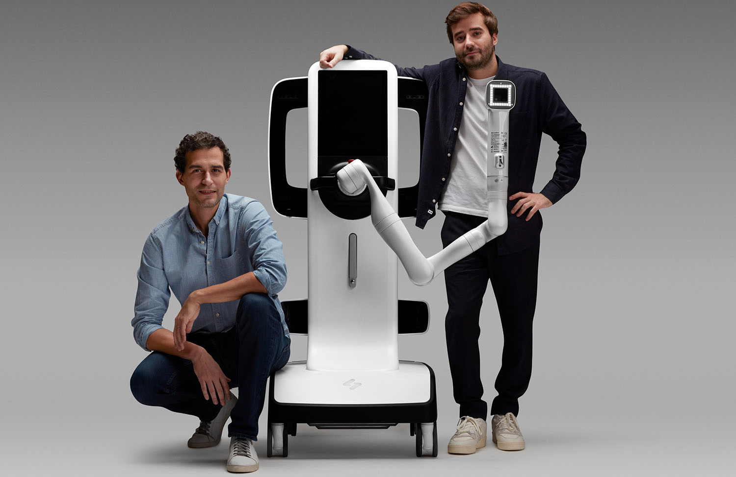 A photo of SquareMind co-founders Ali Khachlouf(left) and Tanguy Serrat with their Swan skin imaging robot.