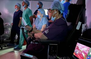 A photo of SS Innovations CEO Dr. Sudhir Srivastava operating with SSi's MantrAsana tele-surgeon console in Georgetown, Guayana.